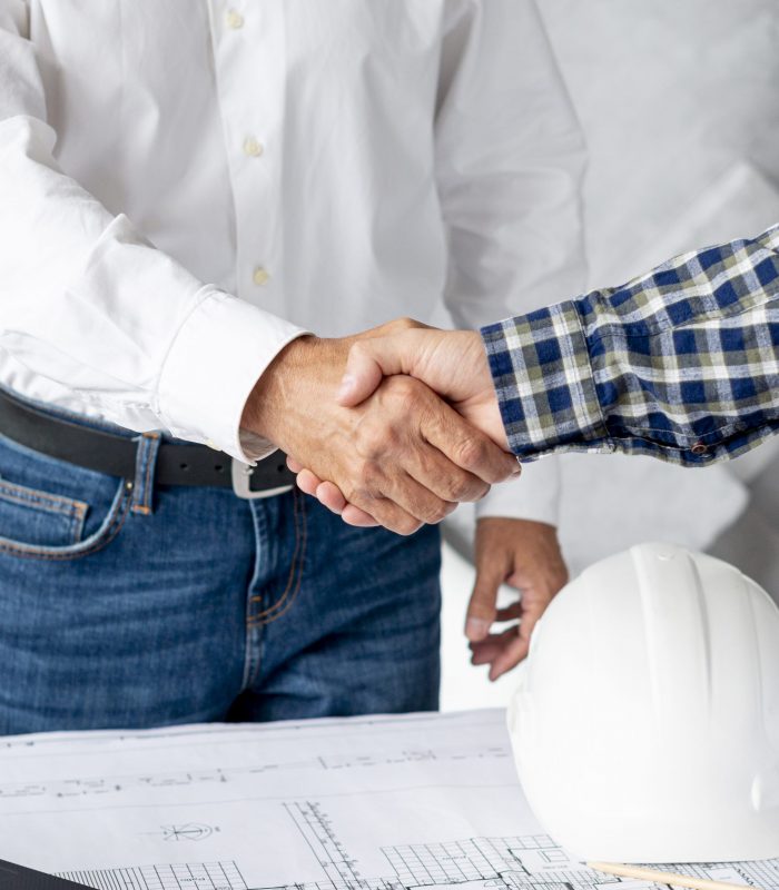 Client shaking hands with the TV engineer after going through the specifications of the job.