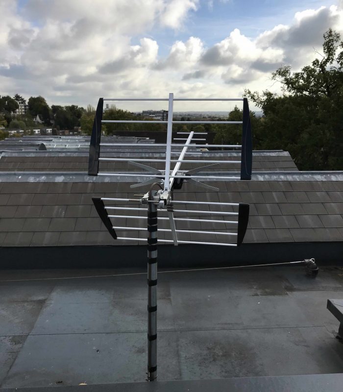 High gain TV aerial installed on a mast pointing to Crystal Palace transmitter to receive a digital Freeview signal.
